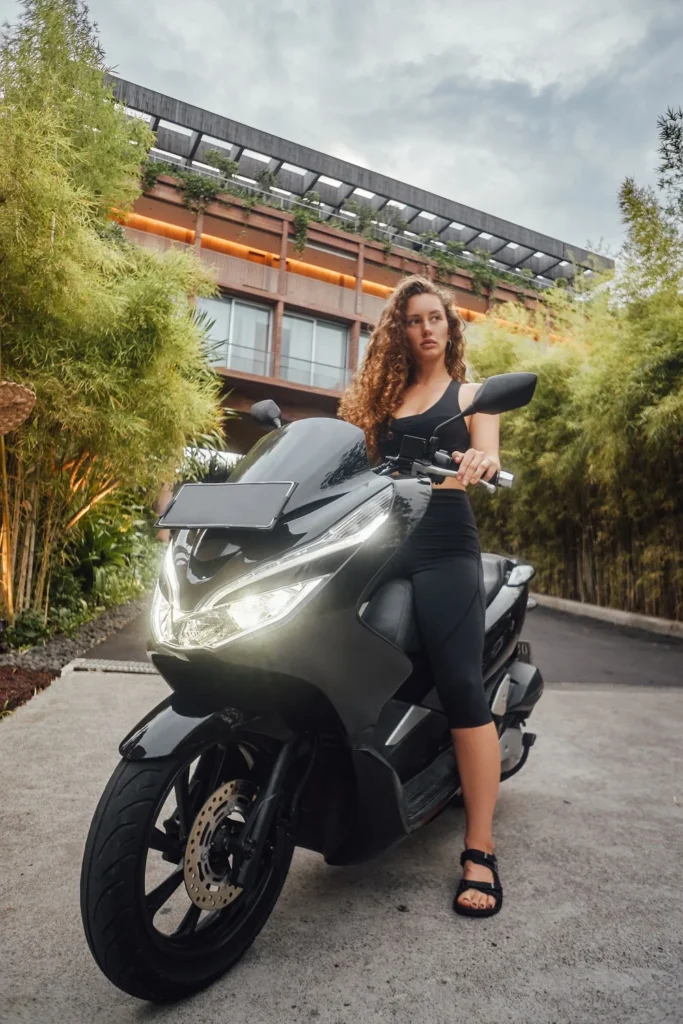 young sportswoman sitting on bike around modern ma 2025 01 26 15 42 47 utc